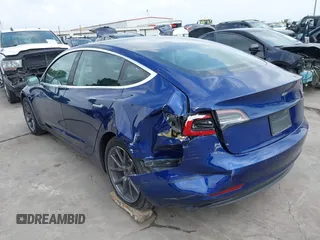 2019 Tesla Model 3 Mid Range with VIN 5YJ3E1EA5KF190453, listed as a IAAI auction lot 41880684 with 58,909 mi miles and . Bid and sale history available at carsss.com. Image 3.