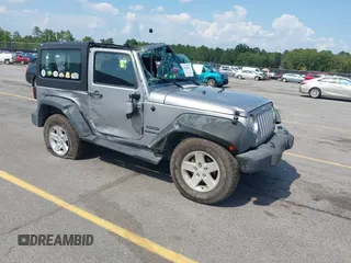 2014 Jeep Wrangler Sport with VIN 1C4AJWAG0EL141737, listed as a IAAI auction lot 42611860 with 113,609 mi miles and . Bid and sale history available at DreamBid. Image 1.