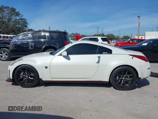 2004 Nissan 350Z Touring with VIN JN1AZ34E74T064156, listed as a IAAI auction lot 41498213 with 148,370 mi miles. Bid and sale history available at carsss.com. Image 14.