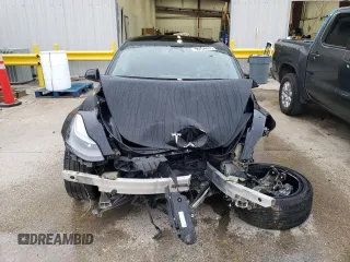2022 Tesla Model 3 with VIN 5YJ3E1EA6NF188263, listed as a Copart auction lot 77542203 with 75,461 mi miles and Non Repairable. Bid and sale history available at DreamBid. Image 5.