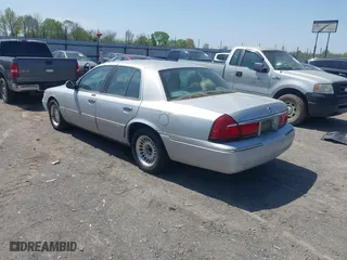 2002 Mercury Grand Marquis LS Premium with VIN 2MEFM75W02X660966, listed as a IAAI auction lot 41869806 with 133,758 mi miles. Bid and sale history available at carsss.com. Image 3.