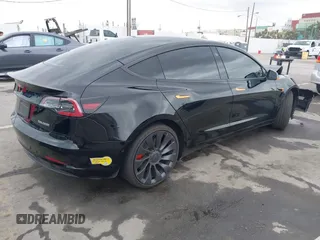 2022 Tesla Model 3 Performance with VIN 5YJ3E1EC3NF248534, listed as a IAAI auction lot 41882694 with 55,415 mi miles and . Bid and sale history available at carsss.com. Image 4.