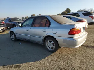 2000 Honda Civic VP with VIN 2HGEJ6612YH563761, listed as a Copart auction lot 83430994 with 170,515 mi miles and Salvage Title. Bid and sale history available at carsss.com. Image 2.