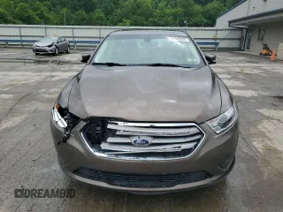 2015 Ford Taurus SEL z VIN 1FAHP2E84FG102075, wystawiony jako Copart lot #59740265 z przebiegiem 90 669 mil mil oraz Szkoda całkowita • Salvage title. Historia ofert i sprzedaży dostępna na DreamBid. Obrazek 5.