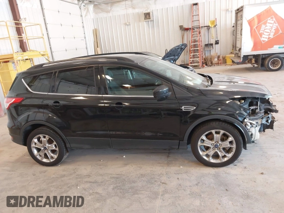 2014 Ford Escape SE with VIN 1FMCU9G95EUA16328, listed as a IAAI auction lot 42464235 with 108,570 mi miles and . Bid and sale history available at DreamBid. Image 13.