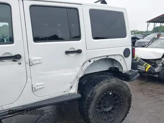 2014 Jeep Wrangler Unlimited Rubicon with VIN 1C4HJWFG4EL104827, listed as a IAAI auction lot 42236622 with 90,935 mi miles and . Bid and sale history available at DreamBid. Image 18.