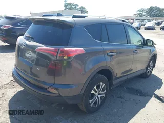 2016 Toyota RAV4 LE with VIN JTMZFREV7GJ086149, listed as a IAAI auction lot 42064251 with 90,104 mi miles and . Bid and sale history available at DreamBid. Image 4.