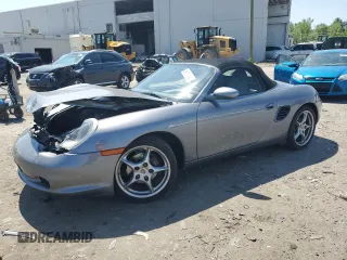 2003 Porsche Boxster z VIN WP0CA29803U623260, wystawiony jako Copart lot #54511835 z przebiegiem 53 596 mil mil oraz Szkoda całkowita • Salvage title. Historia ofert i sprzedaży dostępna na DreamBid. Obrazek 1.