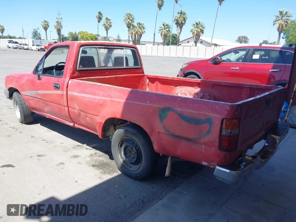 1992 Toyota Pickup DLX z VIN JT4RN82P8N5056666, wystawiony jako IAAI lot #42320829 z przebiegiem 147 032 mil mil oraz . Historia ofert i sprzedaży dostępna na DreamBid. Obrazek 3.