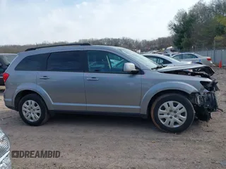 2019 Dodge Journey SE with VIN 3C4PDCBB0KT719211, listed as a IAAI auction lot 41823499 with 151,569 mi miles and . Bid and sale history available at DreamBid. Image 13.