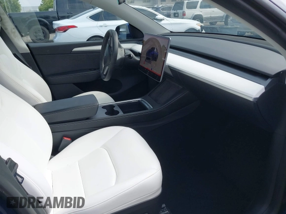 2023 Tesla Model Y Long Range z VIN 7SAYGDEE5PA102285, wystawiony jako IAAI lot #42402981 z przebiegiem 24 550 mil mil oraz . Historia ofert i sprzedaży dostępna na DreamBid. Obrazek 5.