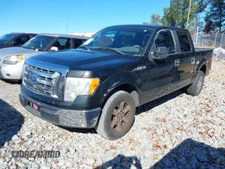 2010 Ford F-150 XL with VIN 1FTEW1CW4AFA86552, listed as a IAAI auction lot 40874001 with 254,545 mi miles. Bid and sale history available at carsss.com. Image 2.