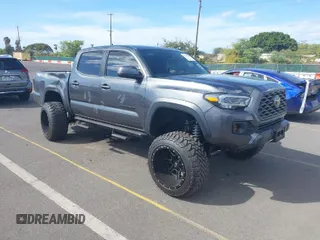 2021 Toyota Tacoma SR z VIN 3TMCZ5ANXMM447464, wystawiony jako IAAI lot #41409203 z przebiegiem 39 390 mil mil oraz . Historia ofert i sprzedaży dostępna na DreamBid. Obrazek 1.