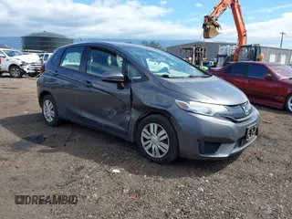 2015 Honda Fit LX z VIN 3HGGK5H52FM787806, wystawiony jako IAAI lot #41558203 z przebiegiem 83 773 mil mil oraz . Historia ofert i sprzedaży dostępna na DreamBid. Obrazek 1.