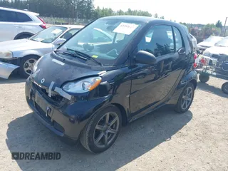 2012 Smart fortwo Pure z VIN WMEEJ3BAXCK526477, wystawiony jako IAAI lot #42392611 z przebiegiem 143 378 mil mil oraz . Historia ofert i sprzedaży dostępna na DreamBid. Obrazek 2.