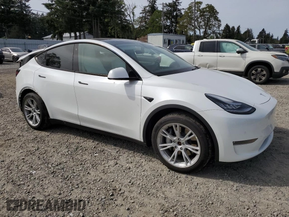 2020 Tesla Model Y Long Range with VIN 5YJYGDEF2LF006357, listed as a Copart auction lot 54888215 with 55,983 mi miles and Salvage Title. Bid and sale history available at DreamBid. Image 4.