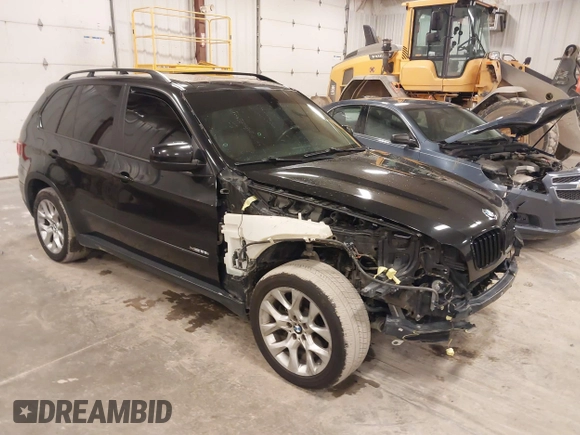 2012 BMW X5 35i with VIN 5UXZV4C55CL990510, listed as a IAAI auction lot 41849293 with 117,522 mi miles and . Bid and sale history available at DreamBid. Image 1.