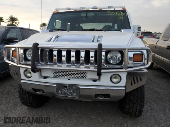 2006 Hummer H2 with VIN 5GRGN22U56H105928, listed as a Copart auction lot 76692904 with 0 mi miles and Salvage Title. Bid and sale history available at carsss.com. Image 5.