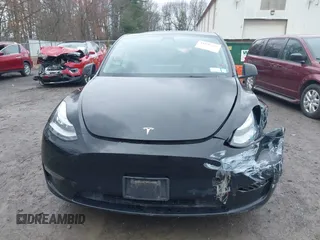 2022 Tesla Model Y Long Range with VIN 7SAYGDEE5NA016892, listed as a IAAI auction lot 41936735 with 69,136 mi miles and . Bid and sale history available at carsss.com. Image 12.