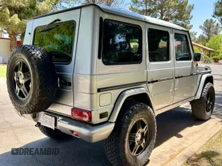 2002 Mercedes-Benz G 500 with VIN WDCYR49EX2X128555, listed as a Copart auction lot 55605995 with 225,042 mi miles and Salvage Title. Bid and sale history available at DreamBid. Image 4.