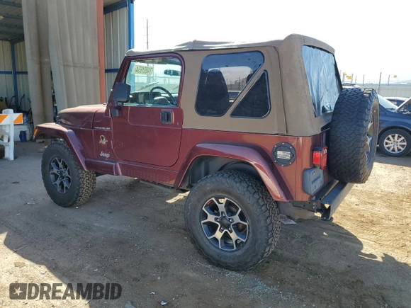 2002 Jeep Wrangler Sahara with VIN 1J4FA59S92P708647, listed as a Copart auction lot 74851654 with 131,794 mi miles and Salvage Title. Bid and sale history available at carsss.com. Image 2.
