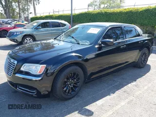 2014 Chrysler 300 with VIN 2C3CCAAG9EH264914, listed as a IAAI auction lot 42003052 with 103,789 mi miles. Bid and sale history available at carsss.com. Image 2.