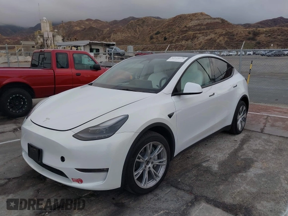 2023 Tesla Model Y Long Range with VIN 7SAYGDEE2PF874729, listed as a IAAI auction lot 41518376 with 10,927 mi miles and . Bid and sale history available at DreamBid. Image 2.