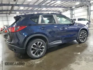 2016 Mazda CX-5 Grand Touring with VIN JM3KE4DY0G0826687, listed as a Copart auction lot 50886975 with 130,493 mi miles and Salvage Title. Bid and sale history available at carsss.com. Image 3.