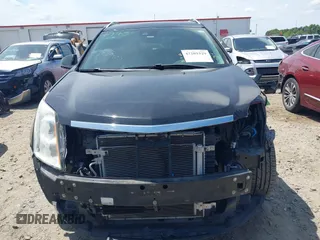 2015 Cadillac SRX Performance Collection z VIN 3GYFNCE30FS549872, wystawiony jako IAAI lot #42201529 z przebiegiem 125 128 mil mil oraz . Historia ofert i sprzedaży dostępna na DreamBid. Obrazek 13.