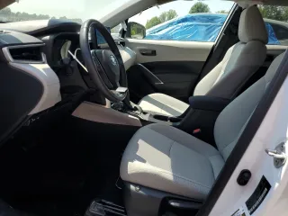 2023 Toyota Corolla Cross LE with VIN 7MUCAABG3PV060880, listed as a Copart auction lot 59664915 with 18,246 mi miles and Salvage title. Bid and sale history available at DreamBid. Image 7.