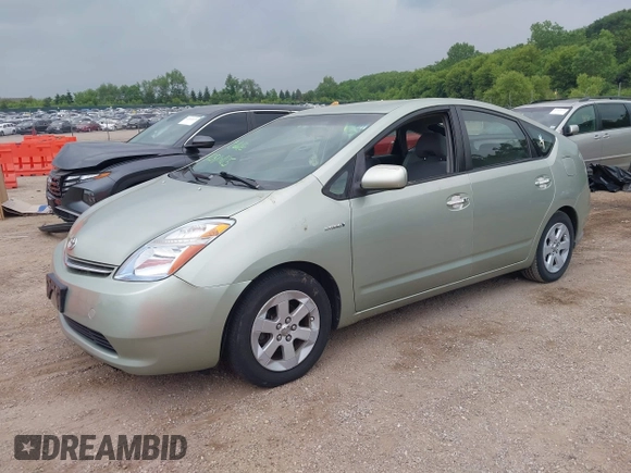 2007 Toyota Prius z VIN JTDKB20U673287354, wystawiony jako IAAI lot #42510185 z przebiegiem 253 448 mil mil oraz . Historia ofert i sprzedaży dostępna na DreamBid. Obrazek 2.