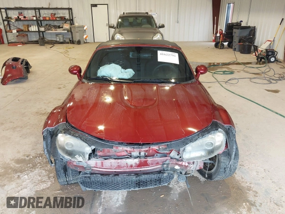 2007 Mazda MX-5 Miata Sport z VIN JM1NC25F970132299, wystawiony jako IAAI lot #41622791 z przebiegiem 72 392 mil mil oraz . Historia ofert i sprzedaży dostępna na DreamBid. Obrazek 13.