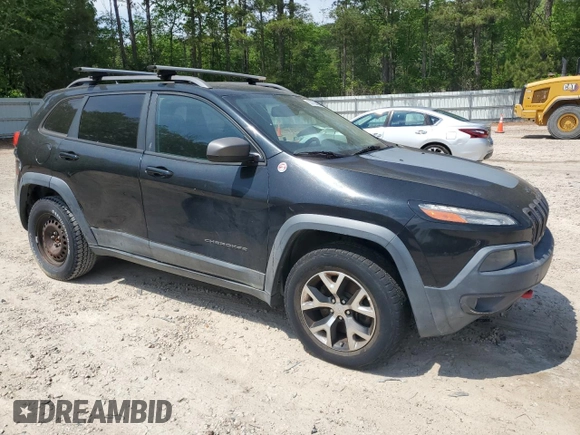 2014 Jeep Cherokee Trailhawk with VIN 1C4PJMBS1EW242527, listed as a Copart auction lot 53160485 with 104,074 mi miles and Salvage Title. Bid and sale history available at carsss.com. Image 4.