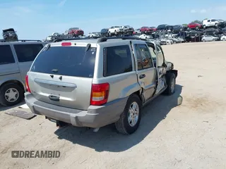 2004 Jeep Grand Cherokee Laredo z VIN 1J4GW48SX4C283922, wystawiony jako IAAI lot #42306869 z przebiegiem 263 812 mil mil oraz . Historia ofert i sprzedaży dostępna na DreamBid. Obrazek 4.