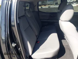 2018 Toyota Tacoma SR with VIN 3TMCZ5AN2JM127244, listed as a IAAI auction lot 41698199 with 61,535 mi miles and . Bid and sale history available at DreamBid. Image 8.