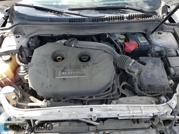 2013 Lincoln MKZ z VIN 3LN6L2G98DR804632, wystawiony jako Copart lot #56985055 z przebiegiem 128 509 mil mil oraz Szkoda całkowita • Salvage title. Historia ofert i sprzedaży dostępna na DreamBid. Obrazek 11.