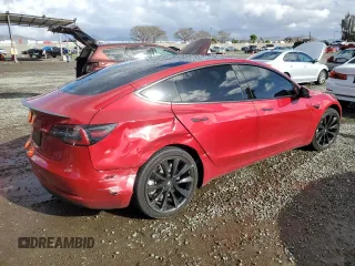 2020 Tesla Model 3 Long Range with VIN 5YJ3E1EB0LF712125, listed as a Copart auction lot 48514815 with 102,397 mi miles and Salvage Title. Bid and sale history available at DreamBid. Image 3.