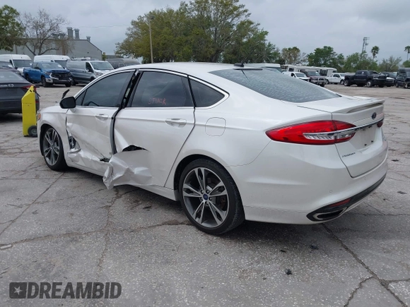 2017 Ford Fusion Titanium with VIN 3FA6P0K99HR272713, listed as a IAAI auction lot 41757334 with 104,733 mi miles. Bid and sale history available at carsss.com. Image 3.