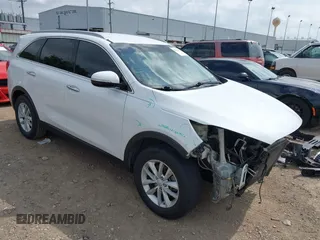 2017 Kia Sorento LX z VIN 5XYPG4A30HG237815, wystawiony jako IAAI lot #42163475 z przebiegiem 124 502 mil mil oraz . Historia ofert i sprzedaży dostępna na DreamBid. Obrazek 1.