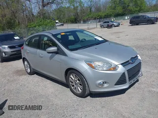2012 Ford Focus SE with VIN 1FAHP3K27CL333433, listed as a IAAI auction lot 42140452 with 156,048 mi miles and . Bid and sale history available at carsss.com. Image 1.