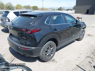 2021 Mazda CX-30 S with VIN 3MVDMBAL6MM302498, listed as a IAAI auction lot 42012356 with 50,477 mi miles and . Bid and sale history available at DreamBid. Image 4.