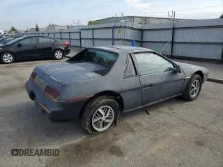 1985 Pontiac Fiero z VIN 1G2PM37R2FP239143, wystawiony jako Copart lot #45717405 z przebiegiem Nie podano mil oraz Tytuł czysty. Historia ofert i sprzedaży dostępna na DreamBid. Obrazek 3.