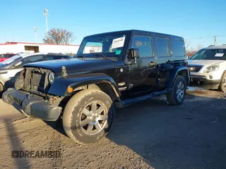 2014 Jeep Wrangler Unlimited Sahara with VIN 1C4BJWEG7EL322316, listed as a IAAI auction lot 41059508 with 144,662 mi miles. Bid and sale history available at carsss.com. Image 2.
