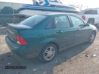 2000 Ford Focus SE with VIN 1FAFP3431YW273376, listed as a IAAI auction lot 39471057 with 214,968 mi miles and . Bid and sale history available at carsss.com. Image 4.