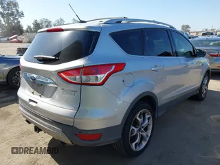 2015 Ford Escape Titanium with VIN 1FMCU0J90FUA43720, listed as a IAAI auction lot 42541048 with 98,948 mi miles and . Bid and sale history available at DreamBid. Image 4.