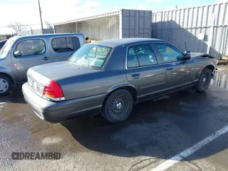 1999 Ford Crown Victoria Police with VIN 2FAFP71W9XX187581, listed as a IAAI auction lot 41522223 with 94,889 mi miles. Bid and sale history available at carsss.com. Image 4.