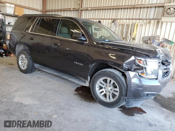 2015 Chevrolet Tahoe LS with VIN 1GNSCAKC5FR501801, listed as a Copart auction lot 50850645 with 112,896 mi miles and Salvage title. Bid and sale history available at DreamBid. Image 4.