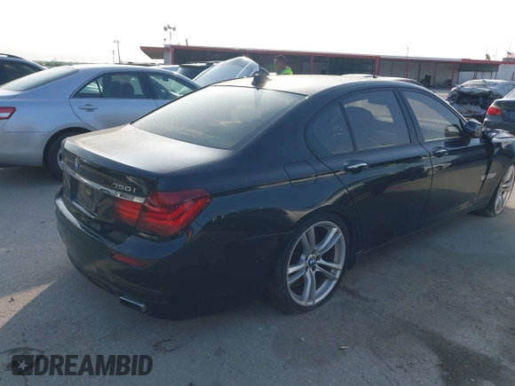 2013 BMW 7 Series 750i with VIN WBAYA8C59DC996552, listed as a IAAI auction lot 41921201 with 99,188 mi miles and . Bid and sale history available at DreamBid. Image 4.