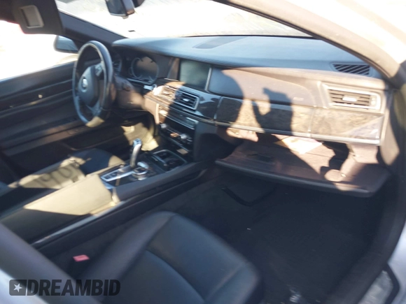 2014 BMW 7 Series 740i with VIN WBAYA6C54ED144450, listed as a IAAI auction lot 41680060 with 999,999 mi miles. Bid and sale history available at carsss.com. Image 5.