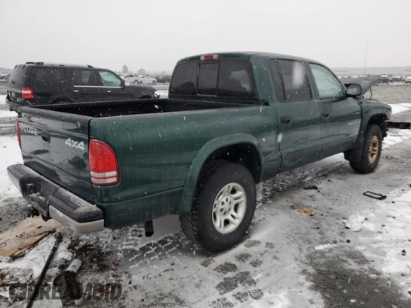2002 Dodge Dakota SLT с VIN 1B7HG48N12S614309, выставлен на аукционе Copart как лот 87309554 с пробегом 287 994 миль миль и Списание • Salvage title. История ставок и продаж доступна на DreamBid. Изображение 3.